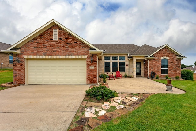 view of front facade with a garage and a front yard