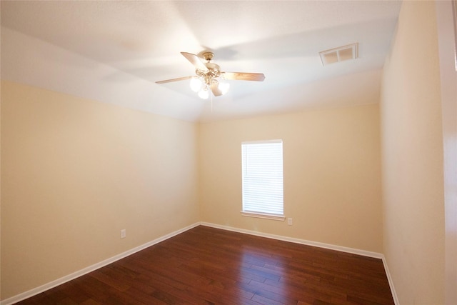 unfurnished room with dark hardwood / wood-style floors and ceiling fan