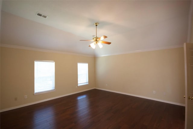 empty room featuring ceiling fan, ornamental molding, and dark hardwood / wood-style floors