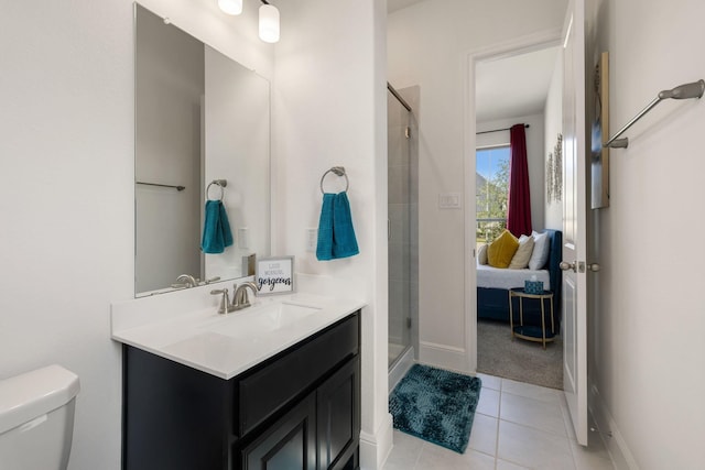 bathroom with vanity, tile patterned floors, toilet, and walk in shower