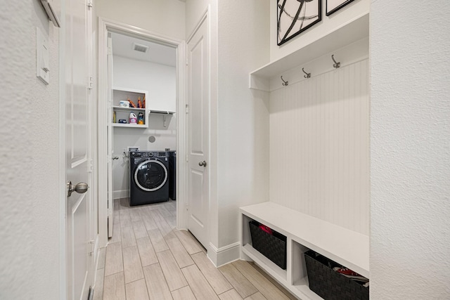 mudroom with washer / dryer