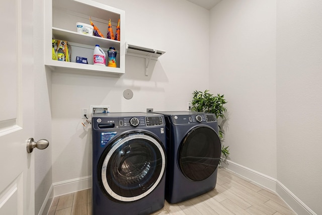 laundry area featuring washing machine and clothes dryer