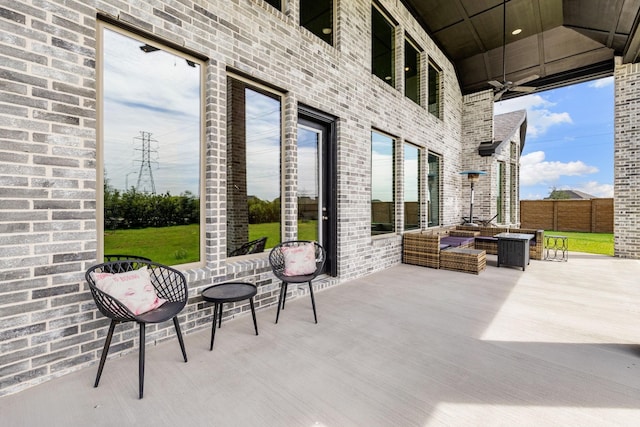 view of patio featuring an outdoor living space and ceiling fan