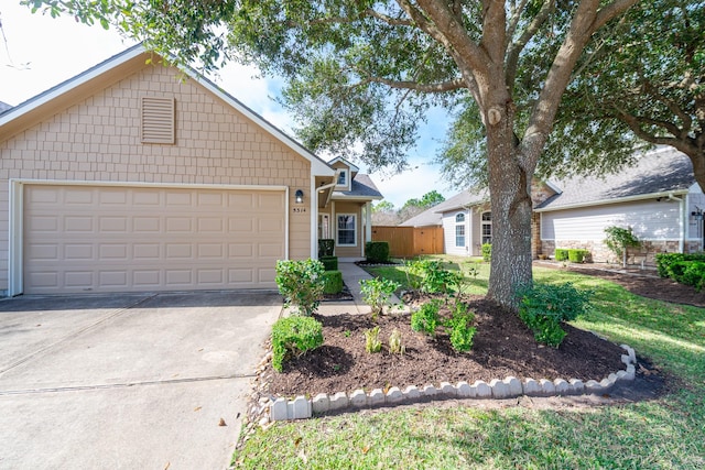 view of front of home with a garage and concrete driveway