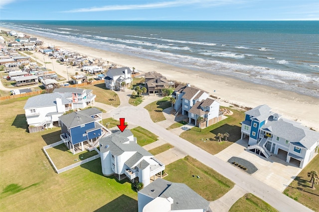 bird's eye view featuring a view of the beach and a water view