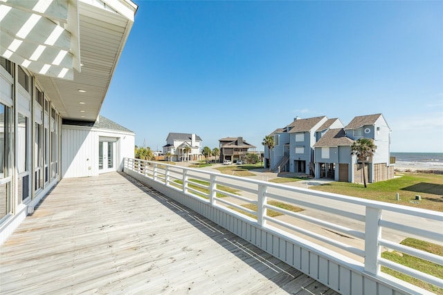 wooden deck featuring french doors and a water view