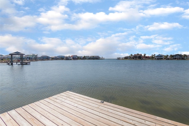 dock area with a water view and a gazebo