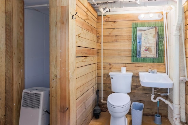 half bathroom with a sink and toilet