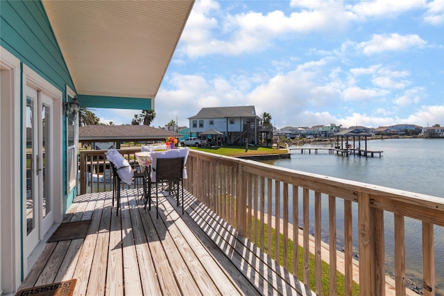 wooden terrace with a water view