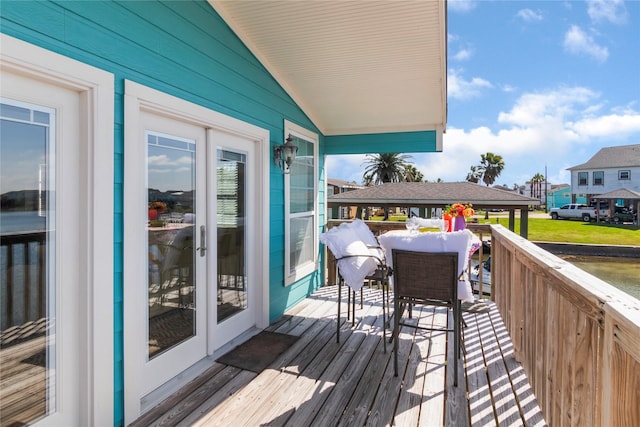 wooden deck featuring french doors