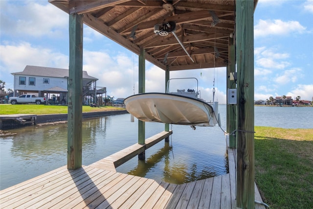 view of dock with a water view and boat lift