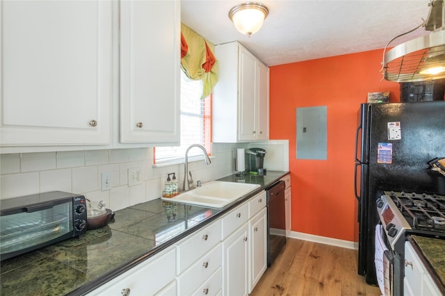 kitchen featuring electric panel, white cabinetry, dishwasher, and a sink