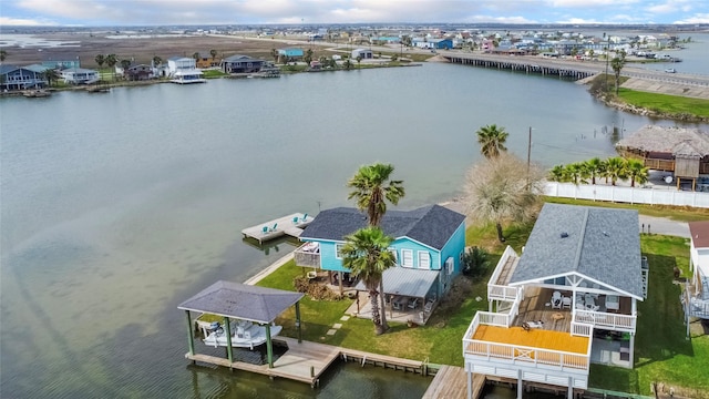 birds eye view of property featuring a water view and a residential view