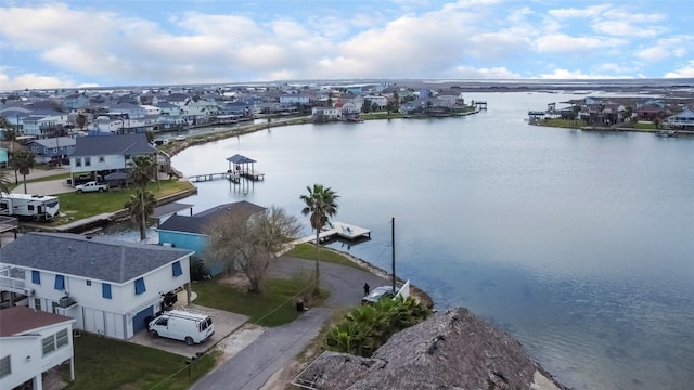 aerial view with a water view and a residential view