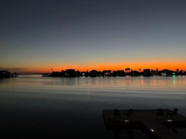 property view of water featuring a boat dock