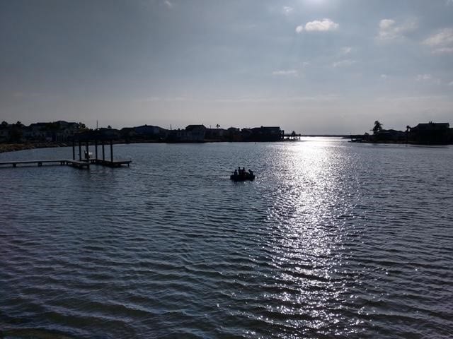 property view of water with a dock