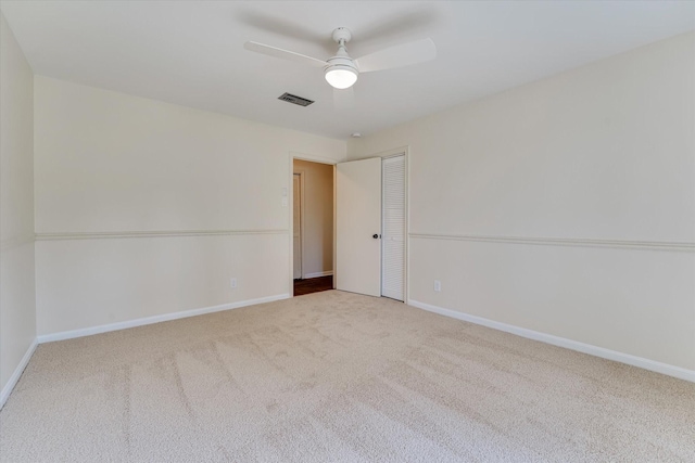 carpeted empty room with ceiling fan