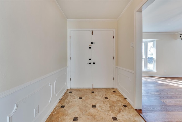 foyer featuring crown molding