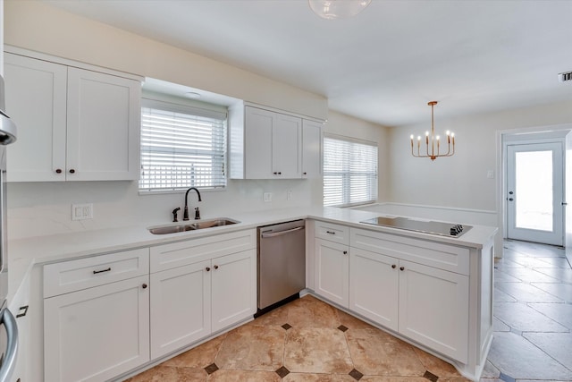 kitchen with pendant lighting, sink, stainless steel dishwasher, kitchen peninsula, and black electric cooktop