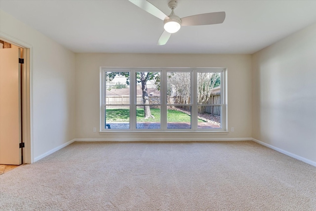 unfurnished room with light carpet, ceiling fan, and a healthy amount of sunlight