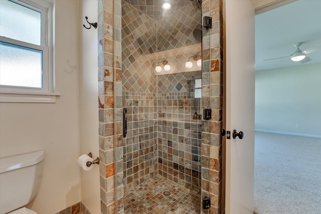 bathroom with toilet and a shower with shower door