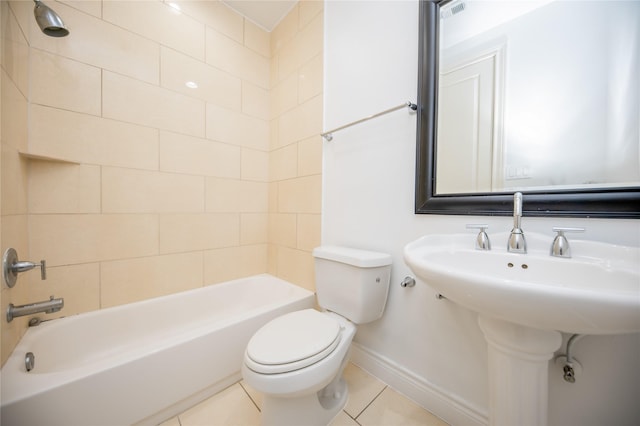 full bathroom featuring tile patterned flooring, baseboards, bathing tub / shower combination, and toilet