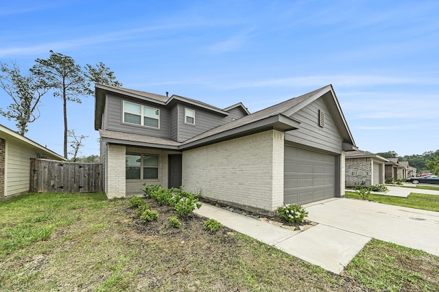 view of front of house featuring a garage and a front lawn