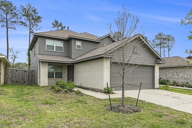 view of front of property featuring a garage and a front yard