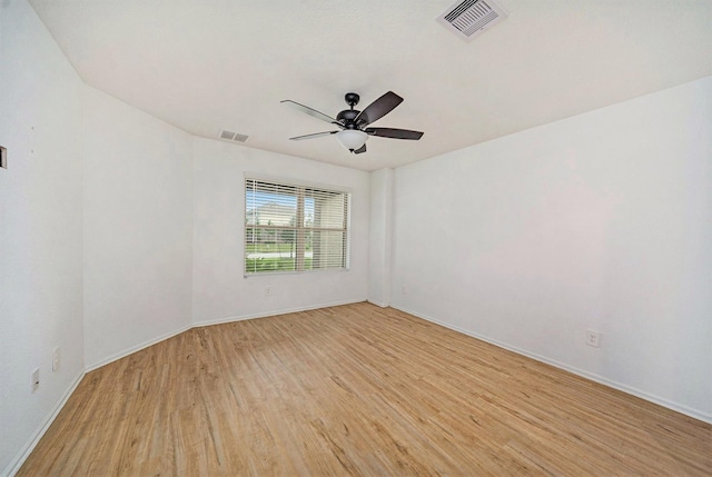 unfurnished room featuring light hardwood / wood-style floors and ceiling fan