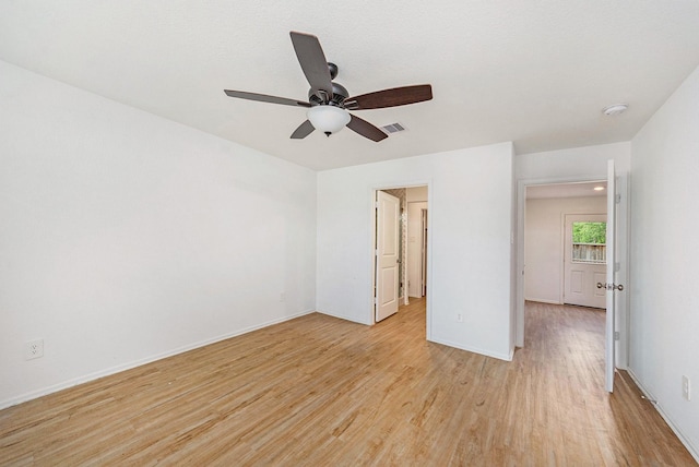 unfurnished bedroom with ceiling fan and light hardwood / wood-style floors