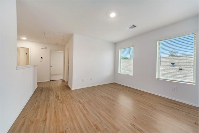 unfurnished room with light hardwood / wood-style flooring