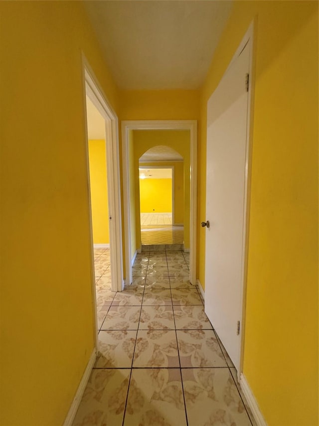 hallway featuring light tile patterned flooring