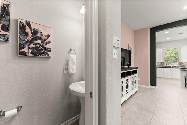 bathroom with decorative backsplash, recessed lighting, tile patterned flooring, and baseboards