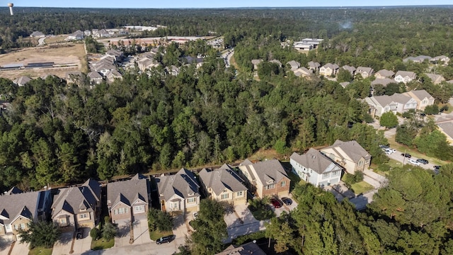 birds eye view of property with a wooded view and a residential view