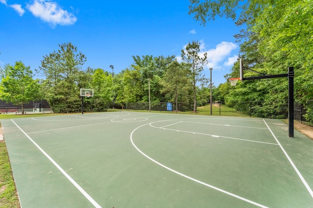 view of sport court featuring community basketball court and fence