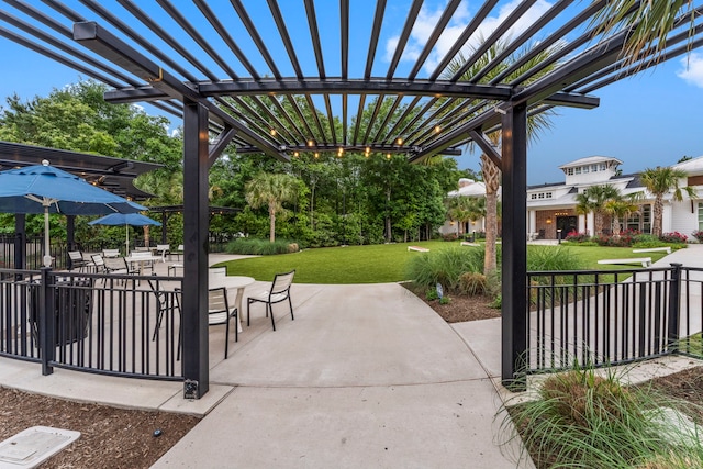 view of patio / terrace with fence and a pergola