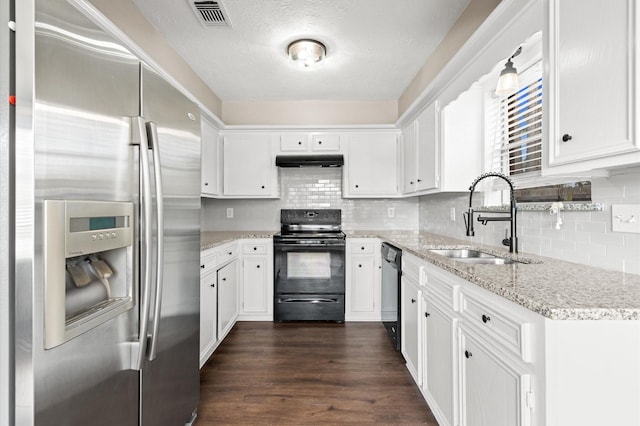 615 Harbor Mist Dr, Crosby, TX 77532 - kitchen with sink, dark hardwood / wood-style flooring, black appliances, white cabinets, and light stone countertops