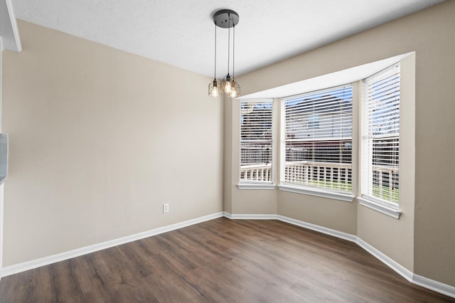 615 Harbor Mist Dr, Crosby, TX 77532 - spare room with dark hardwood / wood-style flooring and an inviting chandelier