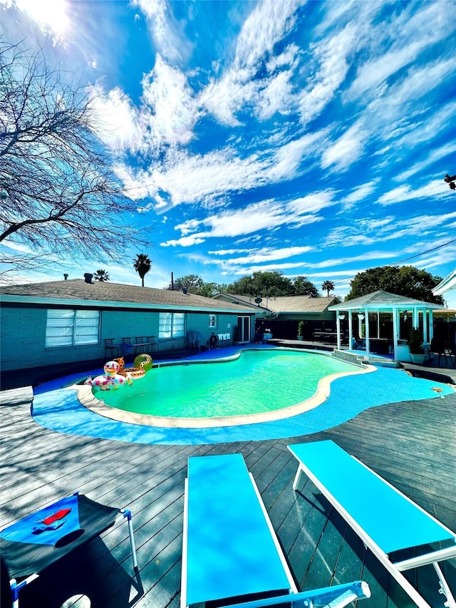 view of pool featuring a deck and a fenced in pool