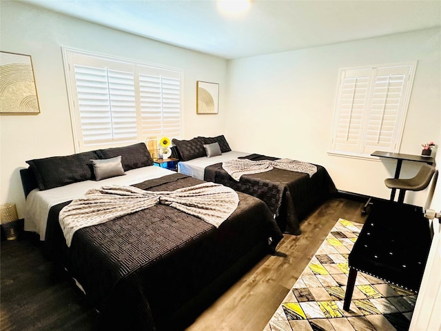 bedroom with wood finished floors