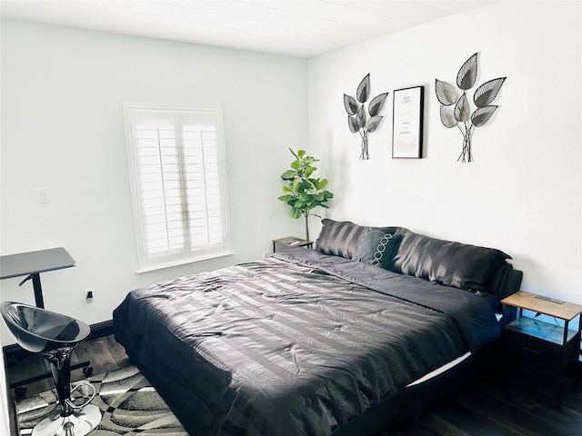 bedroom with wood finished floors