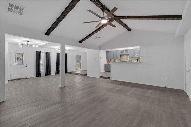 unfurnished living room featuring beam ceiling, light hardwood / wood-style flooring, high vaulted ceiling, and ceiling fan with notable chandelier