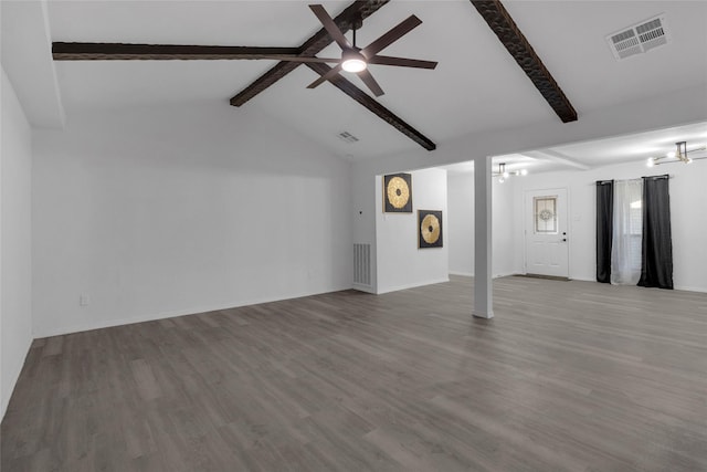 unfurnished living room with ceiling fan, wood-type flooring, and lofted ceiling with beams