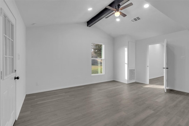 interior space with ceiling fan, hardwood / wood-style floors, and vaulted ceiling with beams