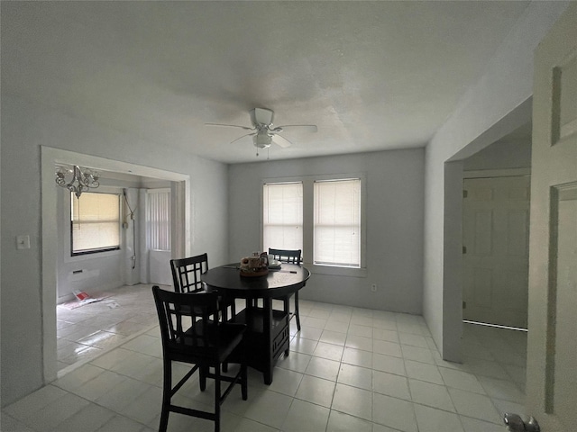 dining room with light tile patterned floors and ceiling fan