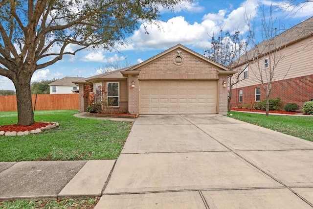 single story home featuring a garage and a front lawn