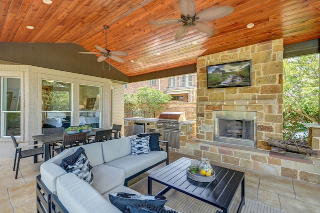 view of patio with an outdoor living space with a fireplace, a grill, an outdoor kitchen, and ceiling fan