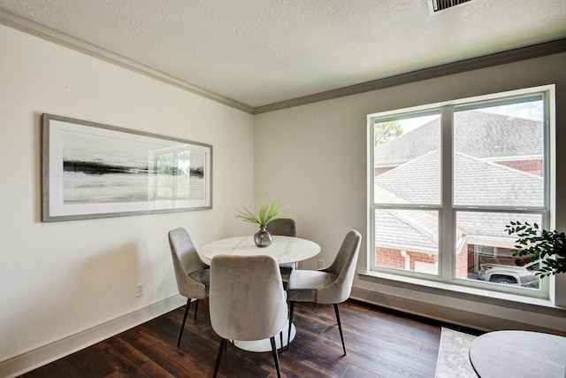 dining space featuring crown molding, a textured ceiling, and dark hardwood / wood-style flooring