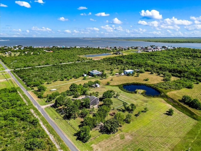 birds eye view of property featuring a water view and a rural view