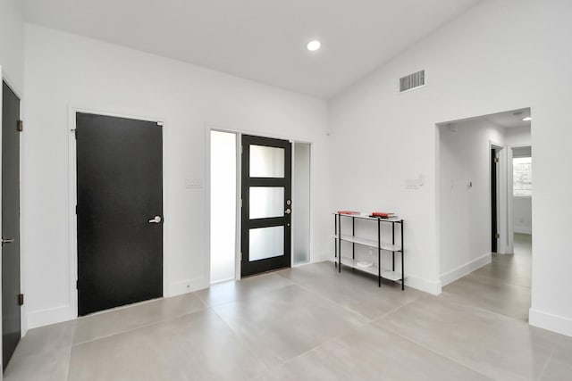 entrance foyer with vaulted ceiling